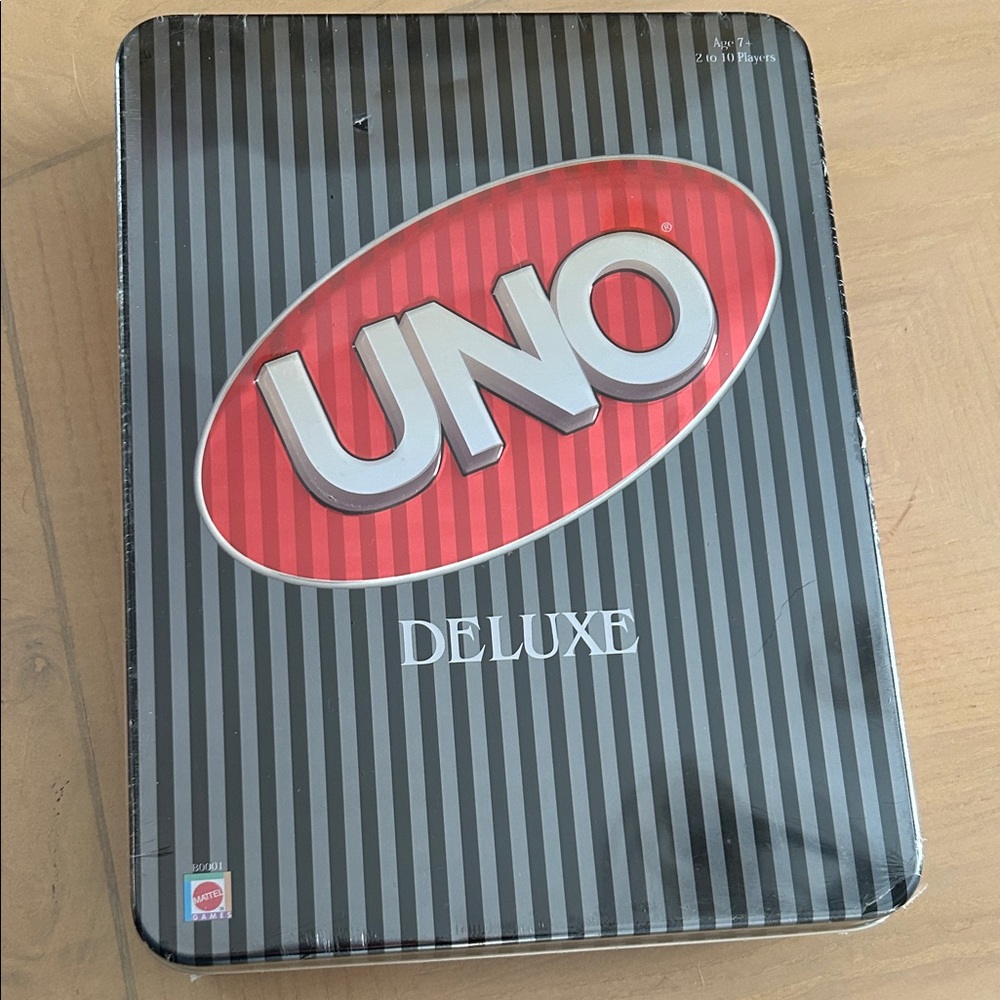 2004. Uno Delux in metal tin. New